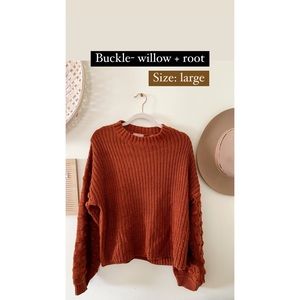 Buckle, rust sweater